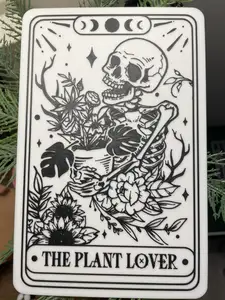 The plant lover skeleton tarot card