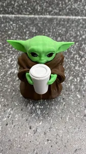 Baby Yoda with starbucks cup coffee