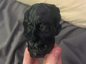 ugly man statue