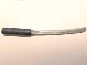 Handle for a knife, stylized as Japanese Tanto.