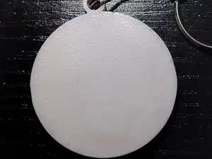 Flat round pocket whistle keychain