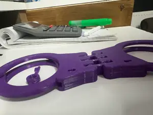 Hinged handcuffs