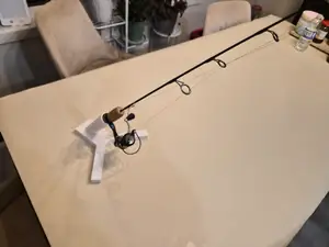 Ice fishing rod holder