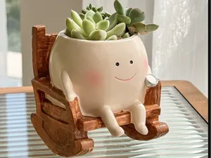 Charming vase on a rocking chair.