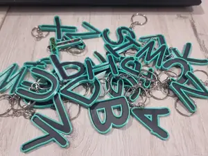 Letters for keychains with raised edge
