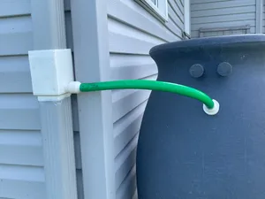 Rainwater diverter with access hatch
