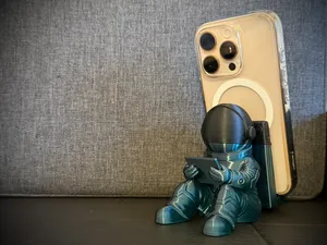 Astronaut phonesStand relaxing space traveler