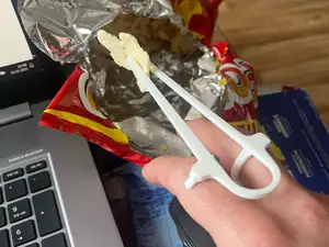 A device for eating chips, nachos, chopsticks