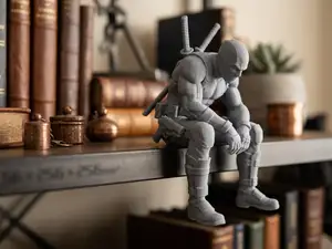 Sad Deadpool sitting on a ledge Figurine!