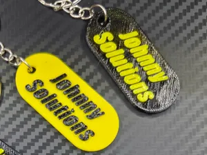 Johnny Solutions dog tag/keychain TPU