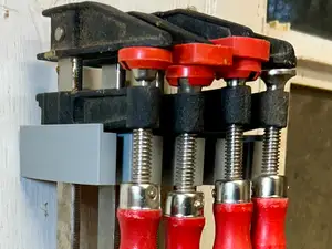 Wall mount Bessey F-style bar clamp holder
