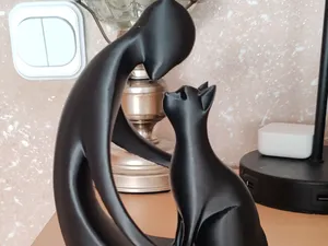 Figurine of a man and a cat in love
