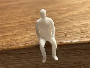 Kleiner sitzender Mann