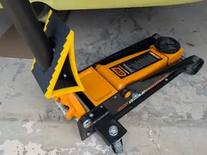 Floor jack storage wheel chock