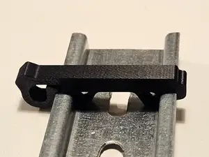 DIN rail stop, slim footprint