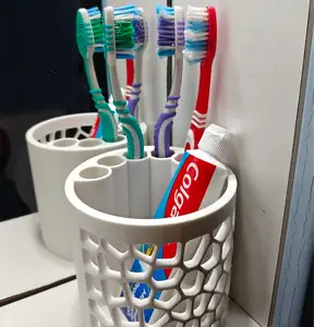 Toothbrush/paste holder with bigger holes