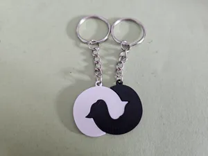 Entwined sleeping cats keychain