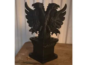 Double headed eagle on a stand