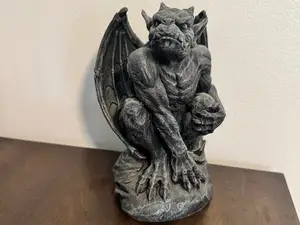 Gargoyle on rock statue