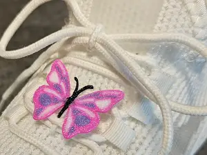Butterfly clip for laces