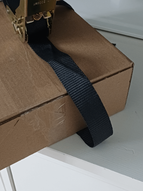 Adjustable corner edge protector for tension strap