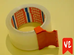 Minimalistic tape dispenser roller with cutter