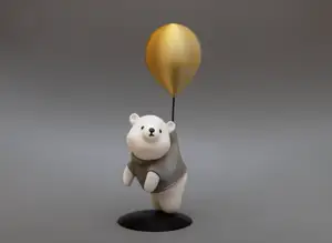 Cute figure of bear flying on balloon
