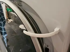 Washing machine door holder