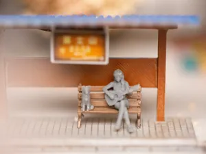 1/64 Diorama Figure: Seated Girl Playing Guitar