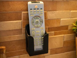 Universal wall-mounted holder for remote