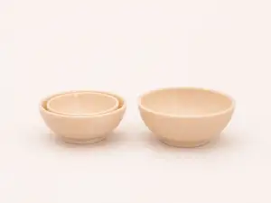 A bowl and tableware suitable for a dollhouse.