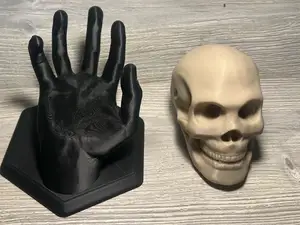 Eternal Embrace: The Hand and Skull Duo