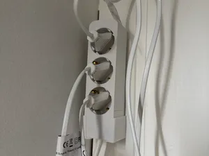 Extension cord wall mount