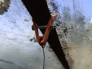 clamp for anchoring growing rods
