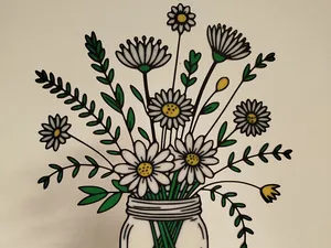 Dekorative Blumen im Glas