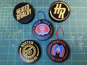 Heated Rivalry Logo & Team Hockey Puck Ornaments