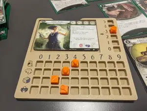 Arkham Horror player dashboard with cubes and arrows