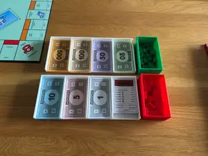 Monopoly trays for money, houses and hotels