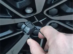 Nutcap/boltcap remover for most cars