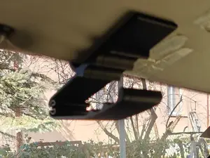 Sun visor phone holder