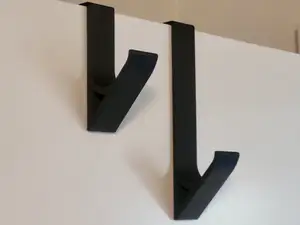 Over door hook for coat hangers, towels etc
