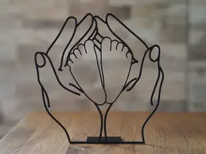 Hands with baby feet