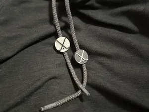 Hockey Puck with Crossing Sticks Drawsting Bead