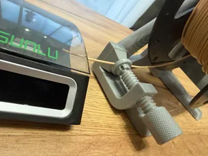 Filament spool holder with a clamp