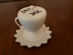 Tea Cup and Saucer That Says "Drink Me"