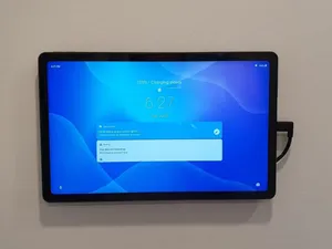 Floating tablet wall mount with charger support