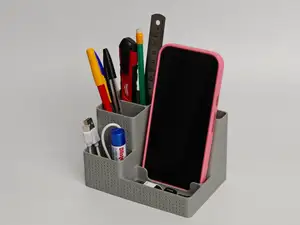 Pebble, a minimal desk organizer and phone stand