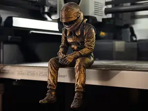 Sad F1 Driver Sitting on a ledge Figurine!