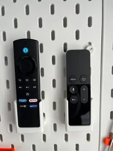 Ikea skadis remote holder.