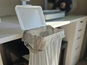 DeskBag: desk-mounted trash bag holder